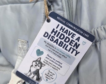 May include: A rectangular medical communication card attached to a light blue backpack with twine. The white card features dark blue text reading I HAVE A HIDDEN DISABILITY, a graphic of a husky, and a request for patience and understanding.