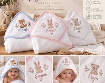 May include: Three white hooded towels with embroidered animal motifs and names. One features a fox with the name Noah, one a rabbit with the name Emma, and one a bear with the name Liam. The towels have colored trim and measure 75 x 75 cm.