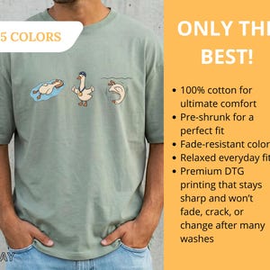 May include: Sage green t-shirt with a cartoon goose design. The shirt features three geese in different poses, with the text "15 COLORS" in a white box. The words "ONLY THE BEST!" are also visible.