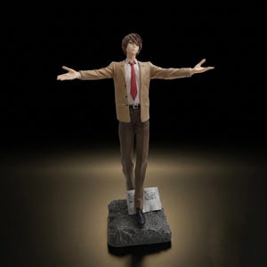 May include: A standing anime-style figure of a person with brown hair, wearing a tan blazer, white collared shirt, red necktie, and brown trousers. The figure has arms outstretched to the sides and stands on a grey rocky base with a small paper.
