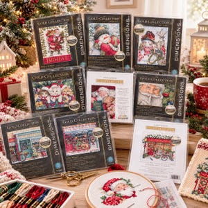 May include: A collection of Dimensions Gold Collection Petites cross stitch kits featuring various holiday and shop themes, including Santa, snowmen, cats, and storefronts, alongside a circular embroidery hoop with a stitched Santa design.