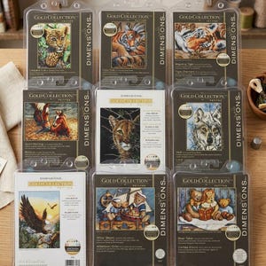 May include: A collection of Dimensions Gold Collection Petites cross-stitch kits. The kits feature various animal designs, including a leopard cub, tigers, a wolf, and bears. Each kit is packaged in a clear plastic case.