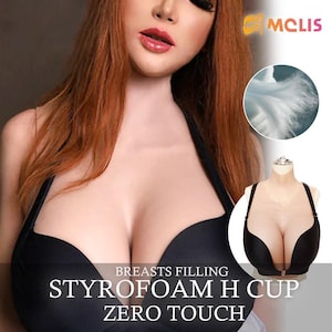 Op de afbeelding: Zwarte bh met een diepe V-hals. De afbeelding bevat de tekst "BREASTS FILLING STYROFOAM H CUP ZERO TOUCH". Een kleinere afbeelding toont een vergelijkbare bh op een mannequin.