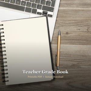 May include: A notebook with blank pages, a gold pen, and a laptop keyboard on a wooden surface. The notebook has the text "Teacher Grade Book" and "Printable PDF • Instant Download".