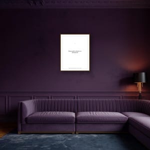 May include: A framed print with the text "Mama needs a timeout, no kids allowed" hangs on a deep purple wall. Below, a plush, purple sectional sofa sits on a dark blue rug. A black lamp with a gold base is to the right.