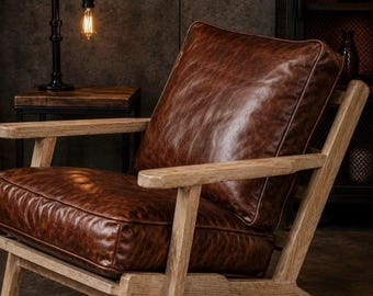 Vintage-style armchair made of genuine leather and natural wood; solid oak armchair