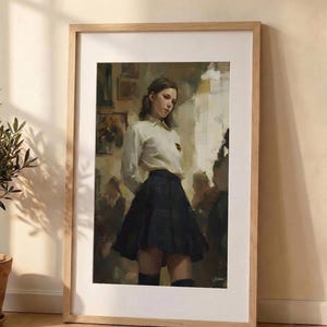 May include: Framed art print featuring a painting of a person in a white collared shirt and a pleated black skirt. The artwork is set in a room with other figures in the background. The frame is made of light-colored wood.