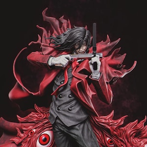 May include: A detailed figurine of a character with long black hair, wearing a red coat and holding two guns. The figure is dressed in a gray suit, white gloves, and a red tie. The background is dark, with red accents.