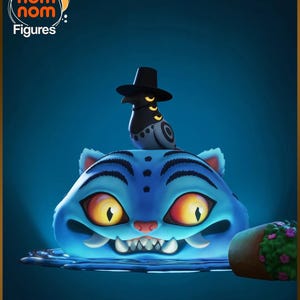 May include: A blue cartoon cat figure with large yellow eyes and sharp teeth, topped with a bird wearing a black hat. The image includes the text "nom nom Figures" in a circular logo.