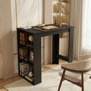 May include: A black desk with an integrated bookshelf on the left. The desk's rectangular top holds a book and decorative items. The bookshelf displays books, a globe, and ornaments. A beige chair is in the foreground. The desk is approximately 120 cm in height.