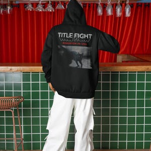 Casual outfit photo with a white crewneck t-shirt, front print shown as Title Fight.