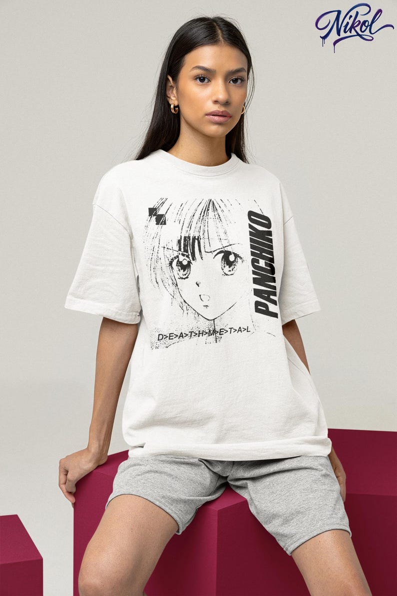 Studio lifestyle shot of a white oversized tee on a model, front print featuring panchiko deathmetal album.