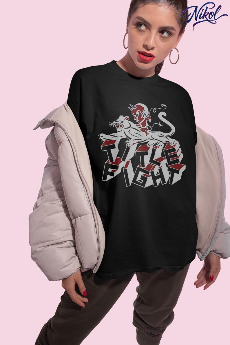 Studio photo of a model in a white t-shirt, front print preview featuring title fight.