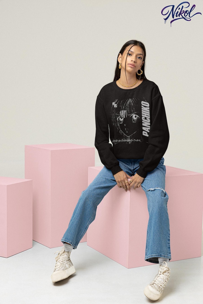 White long-sleeve shirt worn by a model in a seated pose, front print placement showing Panchiko deathmetal album.