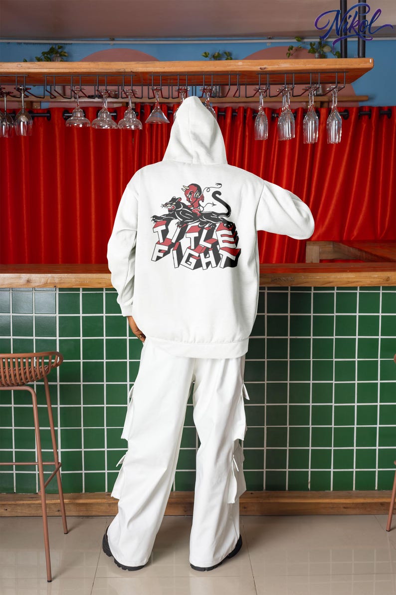 White hoodie back view product photo on a model, showing title fight centered on the back.