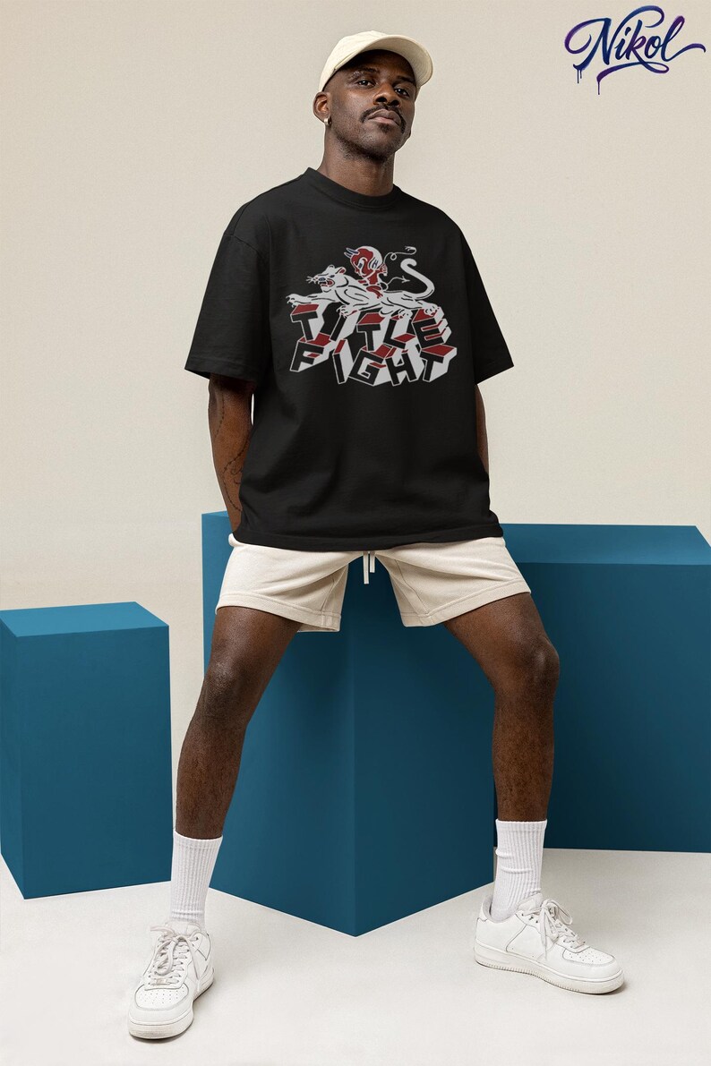 Sunlit white tank top mockup on sandy background, front print placement showing title fight.