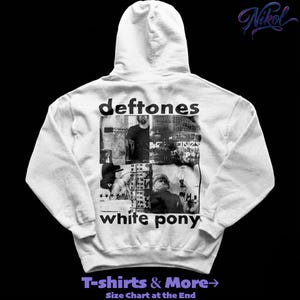 May include: White hooded sweatshirt featuring the band name "deftones" and "white pony" printed in black. The design includes black and white images. The sweatshirt has a drawstring hood and a kangaroo pocket. The text "T-shirts & More" is also visible.