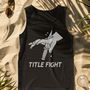 Front print lifestyle image of a white t-shirt, showcasing title fight with natural fabric drape.