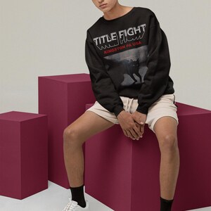 White long-sleeve shirt front print preview in a lifestyle studio setup, featuring Title Fight on the torso.