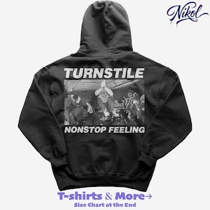 May include: Black hooded sweatshirt featuring the word "TURNSTILE" above a black and white band image. Below the image, the words "NONSTOP FEELING" are printed. The sweatshirt has a drawstring hood and long sleeves. The text "T-shirts & More" is printed at the bottom.