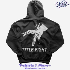 White hoodie mockup, back view on black background with title fight printed on the back.