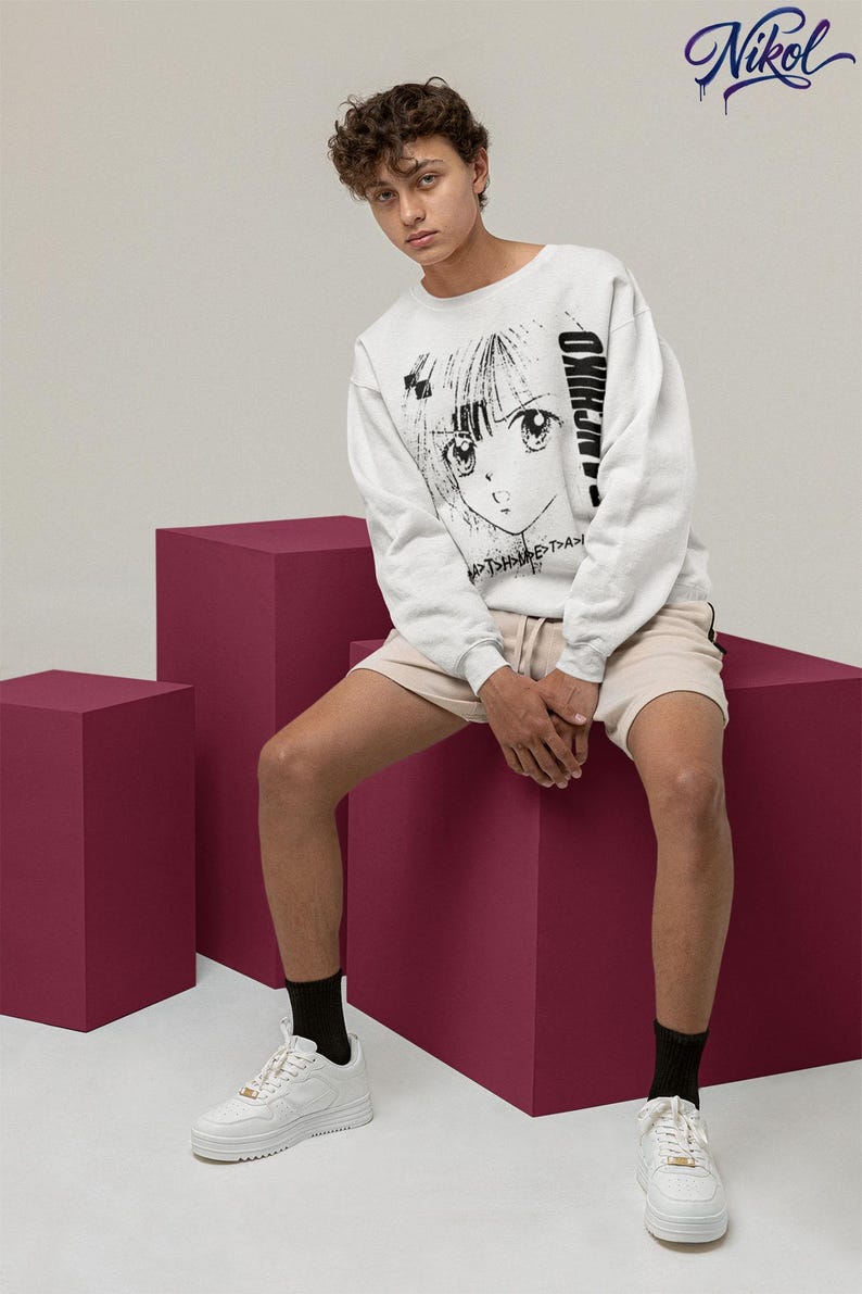Model wearing a white long-sleeve shirt in a relaxed seated pose, displaying panchiko deathmetal album on the front.
