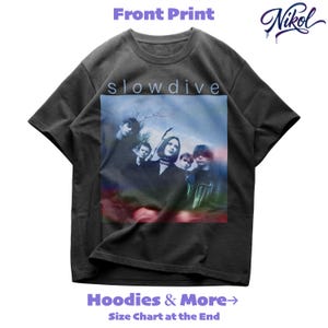 May include: Charcoal grey t-shirt with a band photo and the word "slowdive" above it. The shirt also has the text "Hoodies & More" and "Size Chart at the End". A stylized signature is in the upper right corner.