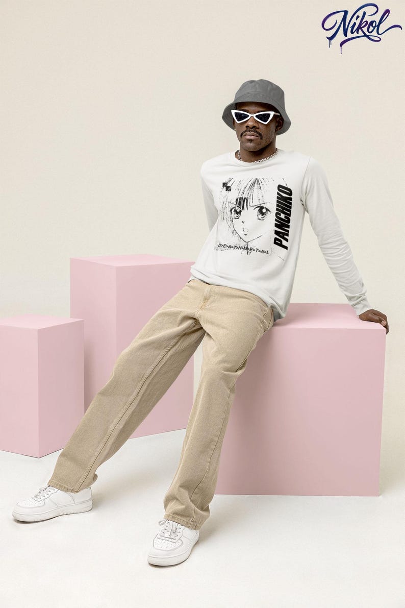 White long-sleeve t-shirt lifestyle scene with soft lighting, featuring panchiko deathmetal album on the front.