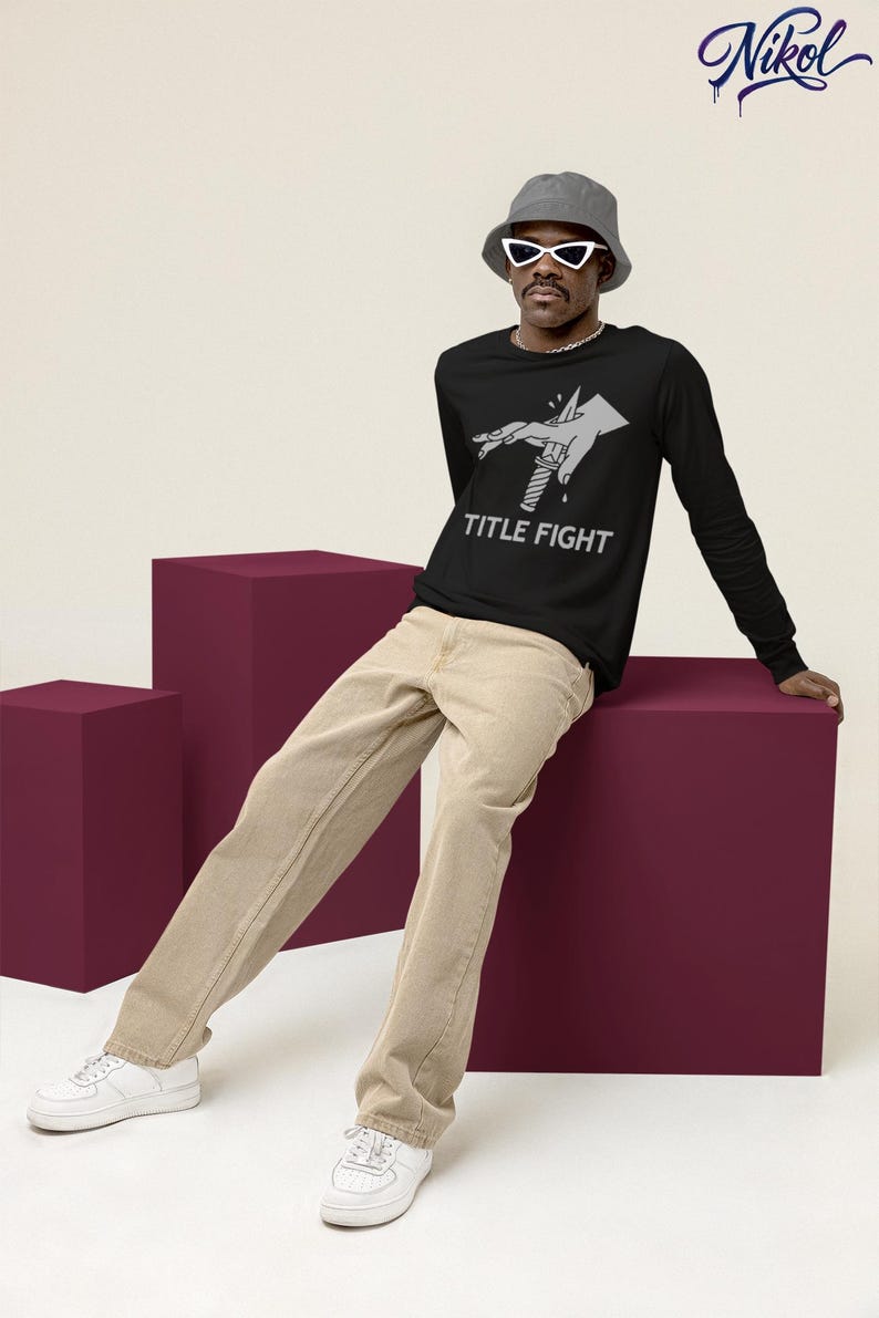 White unisex t-shirt worn by a model, front print display showing title fight clearly.