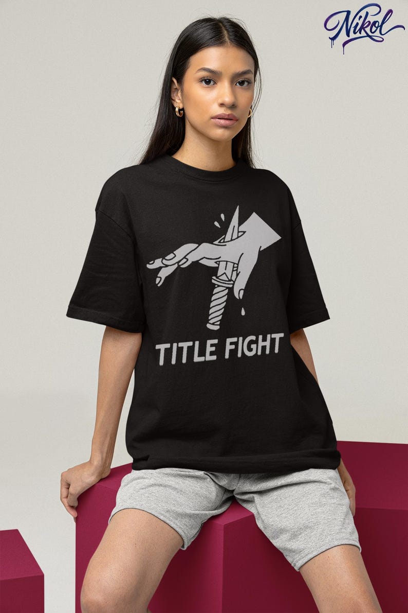 White sweatshirt worn by a model, front print placement with title fight on the main chest area.