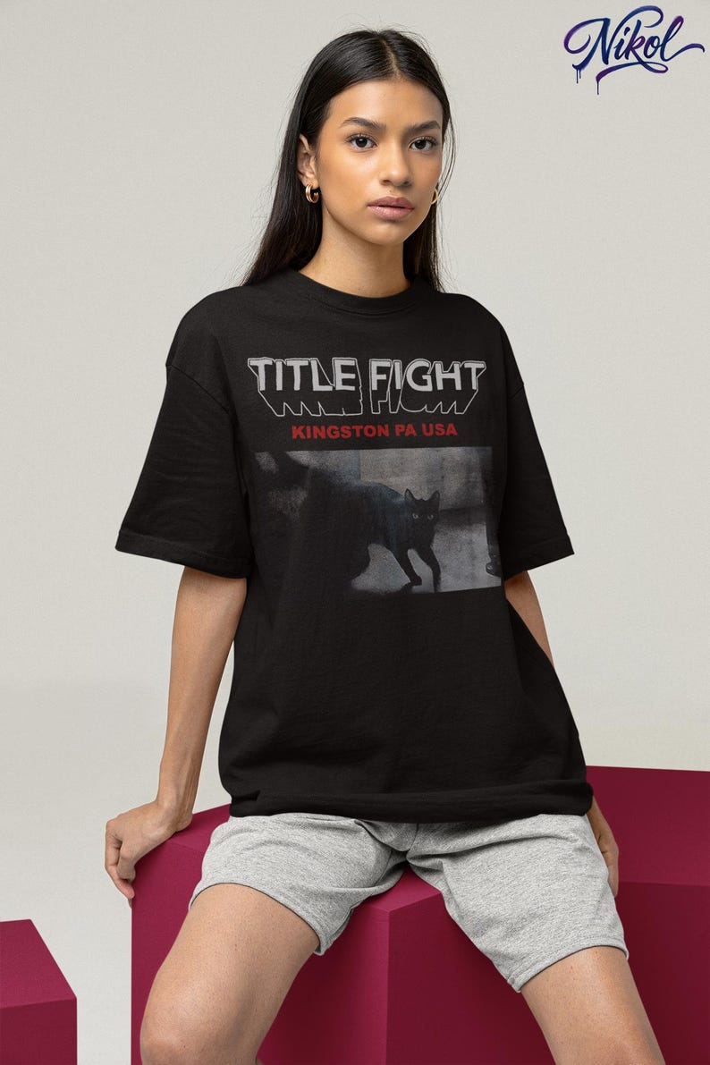 Studio lifestyle shot of a white pullover sweatshirt with Title Fight centered on the front.