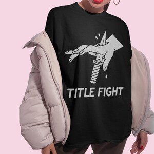 Front print lifestyle mockup of a white oversized t-shirt, title fight centered on the chest area.