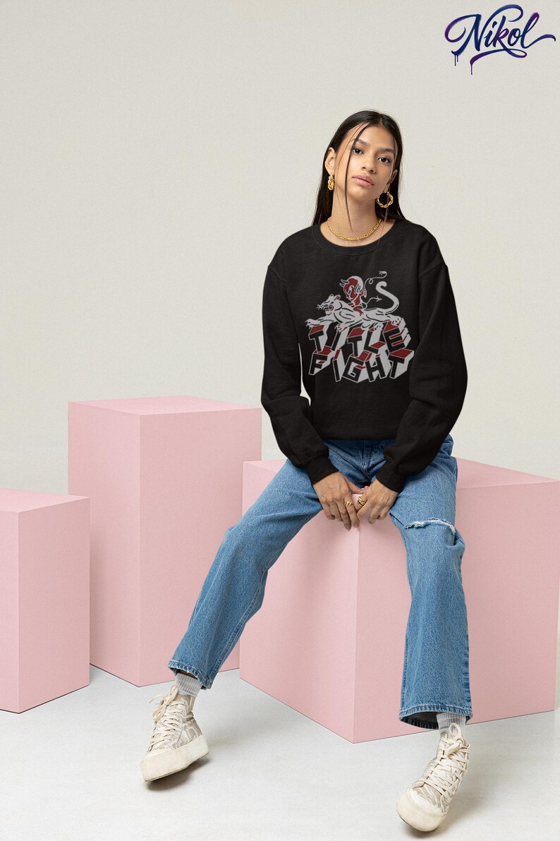 Model wearing a white long-sleeve shirt, front design area customized with title fight.