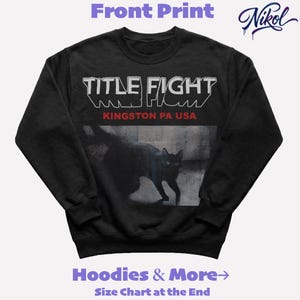 White sweatshirt mockup, front print layout with high contrast background and Title Fight centered on the chest.