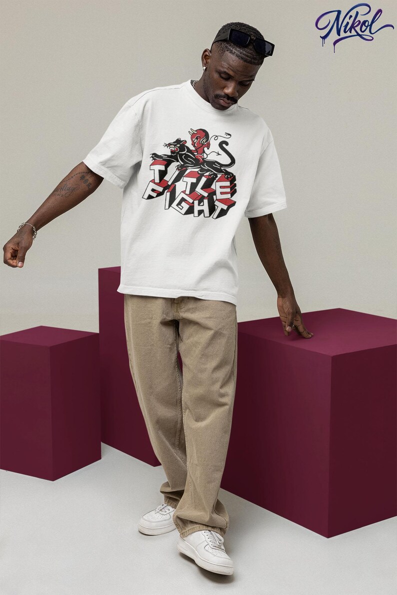 E-commerce lifestyle mockup of a white t-shirt on a model, front print shown as Title Fight.