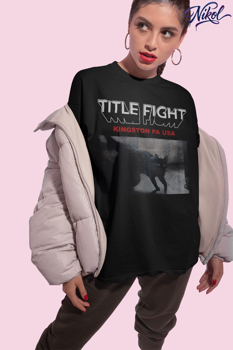 Front print lifestyle mockup of a white oversized t-shirt, Title Fight centered on the chest area.