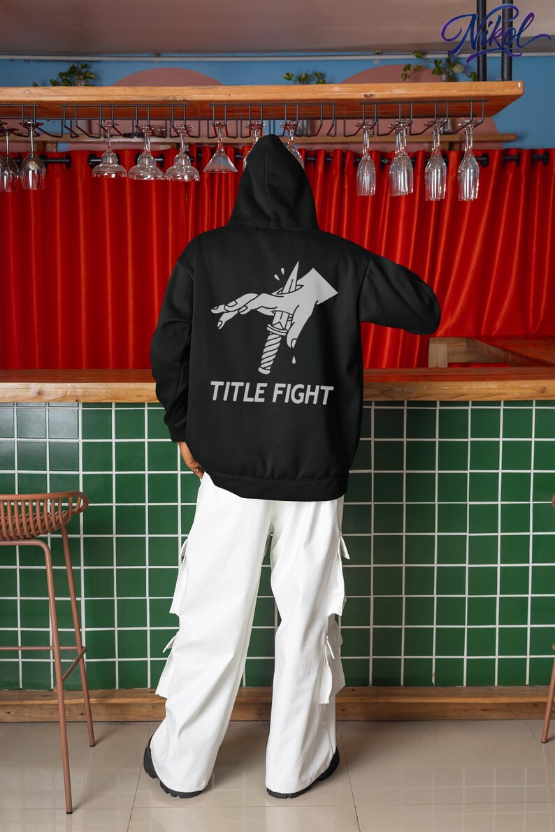 E-commerce lifestyle mockup of a white t-shirt on a model, front print displaying title fight.
