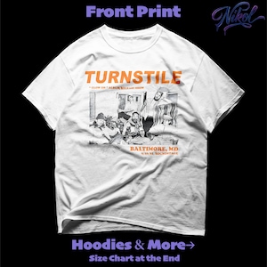 May include: White t-shirt with the word "TURNSTILE" in orange block letters above a black and white band photo. Below the photo is "BALTIMORE, MD 9/16/21 SOUNDSTAGE". The shirt also has the text "GLOW ON ALBUM RELEASE SHOW".