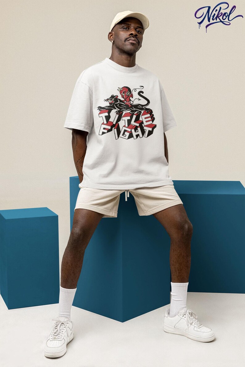 Front print lifestyle image of a white t-shirt, showcasing title fight with natural fabric drape.