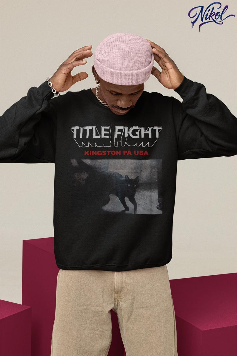 White hoodie back print lifestyle mockup with hood up, showcasing Title Fight on the back panel.