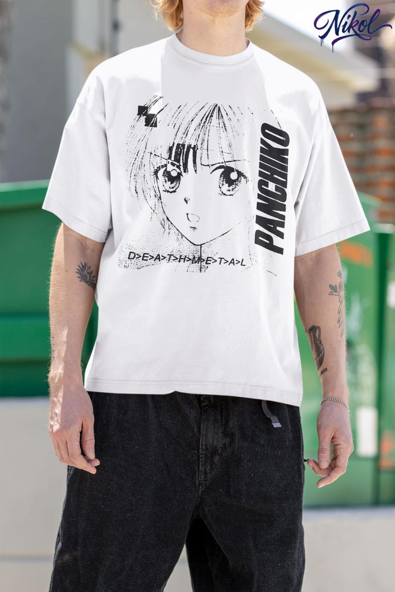 Close-up outdoor view of a white t-shirt, front design area showing panchiko deathmetal album.