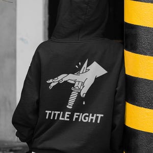 Front print lifestyle mockup of a white t-shirt on a model, featuring title fight for product listings.