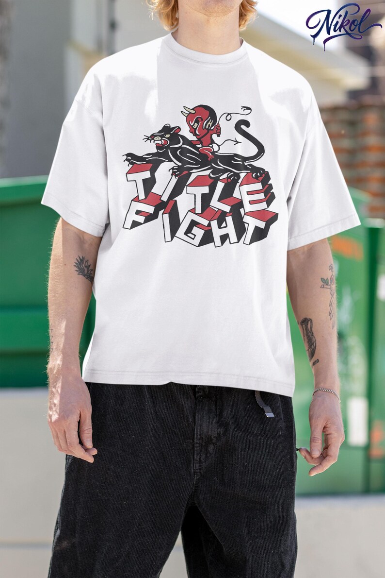 White t-shirt lifestyle mockup in an outdoor setting, front print displayed as title fight.