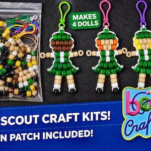 May include: A craft kit containing a clear plastic bag of assorted brown, green, yellow, and white beads, three assembled doll keychains with colorful clips, and a patch with the text "bead Crafts". The kit includes text "MAKES 4 DOLLS", "GIRL SCOUT CRAFT KITS!", and "FUN PATCH INCLUDED!".