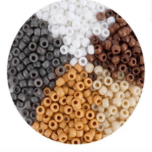 May include: A collection of small, cylindrical pony beads arranged in a circular display. The beads are sorted into five distinct color groups: solid white, dark charcoal gray, rich chocolate brown, light tan, and creamy off-white.