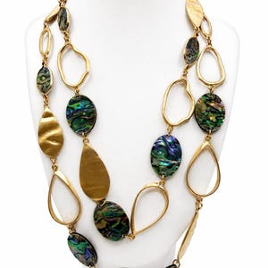 May include: A multi-strand necklace featuring gold-toned metal links in irregular oval and teardrop shapes, interspersed with polished, iridescent abalone shell discs displaying vibrant green, blue, and purple hues throughout the design.