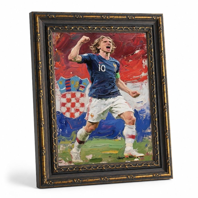 May include: Framed oil painting of a soccer player in a blue jersey with the number 10, celebrating a goal. The background features the Croatian flag and a coat of arms. The frame is black with gold accents.