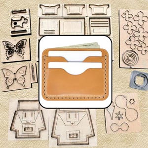 May include: A tan leather card holder with two horizontal slots containing white cards, surrounded by various wooden cutting dies featuring shapes like butterflies, flowers, and geometric patterns on a textured light beige background.