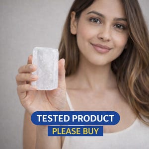 May include: A clear, rectangular crystal held in a hand. The crystal has a textured surface. The image includes the text "TESTED PRODUCT PLEASE BUY" in a blue banner.