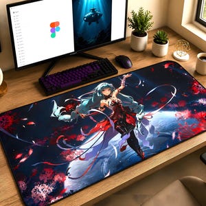 May include: A rectangular desk mat featuring a dark blue background with a central anime-style character with long light blue hair, wearing a red and black outfit, surrounded by floating red flower petals and glowing light effects across the surface.